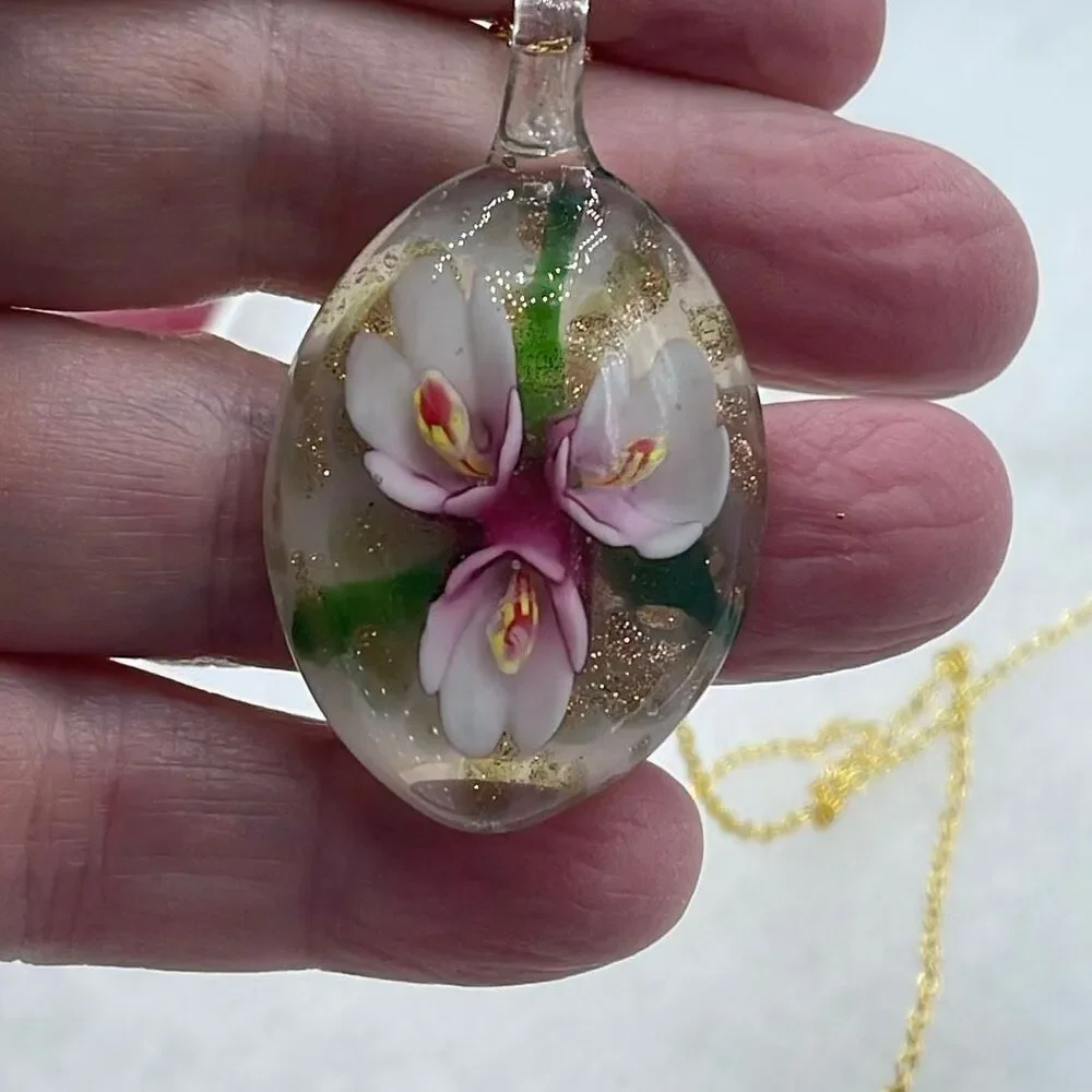 Floral art glass pendant on a 925 plated gold chain.